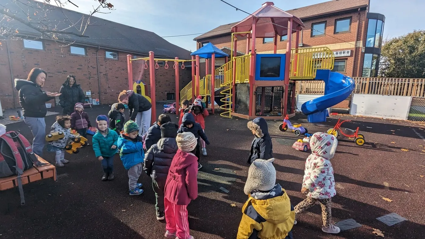 Children on the playground at Good Shepherd Day Care Centre